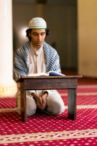 a-muslim-man-sits-in-silence-on-the-carpet-in-holy-2024-01-22-15-46-53-utc (1)